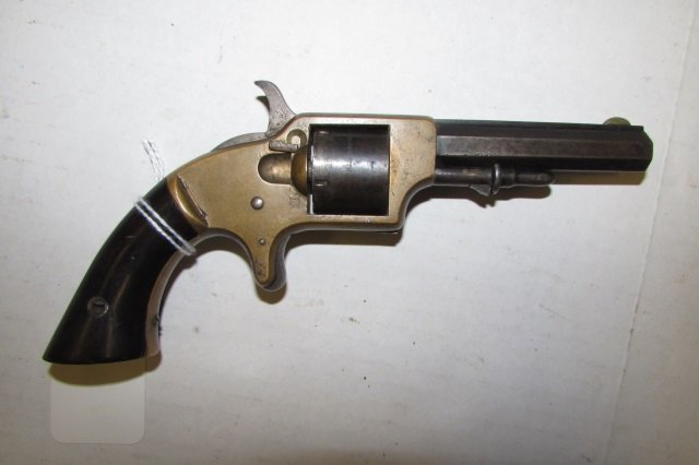 SPRINGFIELD,SMITH & WESSON POCKET REVOLVER HANDGUN: 189.3. 5 SHOT 30 CALIBER GUN PISTOL. FRAME MARKED "SPRINGFIELD ARMS CO.MASS.", CYLINDER MARKED " PAT APRIL3, 1855 MANUFACTURED FOR SMITH & WESSON". BRASS FRAME, WOOD GRIPS WITH CHIP, 3" BARREL.