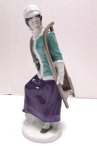 MEISSEN GIRL WITH SLEIGH: 10 INCH TALL GIRL WITH SLED SIGNED ON BOTTOM NO CHIPS NO CRAZING NO BOX