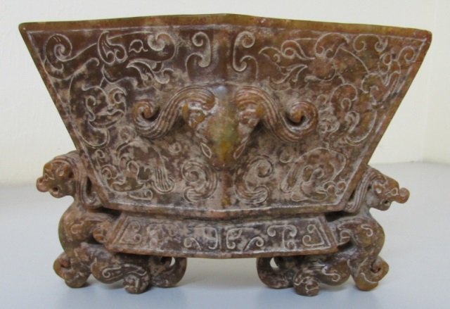 CARVED JADE BOWL VASE W CERT HAN DYNASTY: 7" WIDE BY 5" TALL BY 3 1/2" WIDE. EXCELLENT CONDITION, MINOR SURFACE ABRASION. WITH ALL STONE THERE ARE INTERNAL INCLUSIONS. WITH CERTIFICATE. WEIGHS 930 GRAMS.