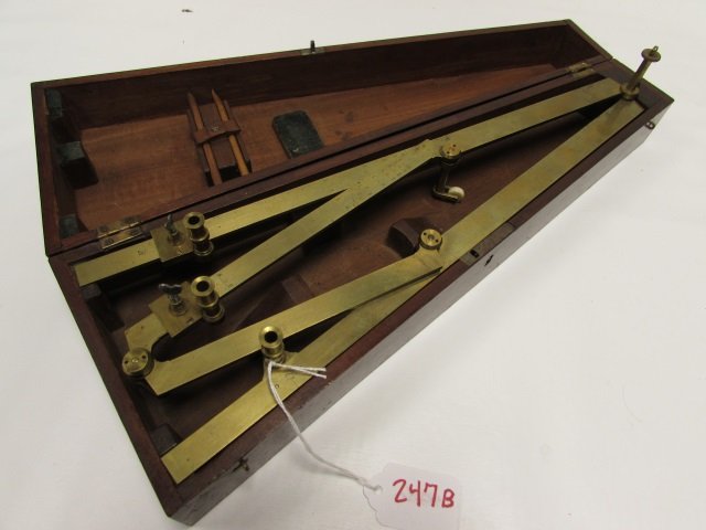 C.1920 SIGNED B BRASS SHIP'S PROTRACTOR WHEEL: COMPASS / PROTRACTOR FOR USE ON A SHIP'S MAP. HAS SEVERAL MEASUREMENTS AND A 'B' MARKED ON EACH PART. INCLUDES ORIGINAL PENCILS AND BONE WHEELS. BOX AND BRASS SHOW WEAR.