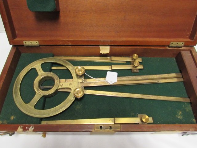 H HUGHES & SON LONDON BRASS SHIP'S COMPASS & BOX: MARKED "H. HUGHES & SON LTD LONDON No. 2648" INCLUDES THREE EXTRA COMPASS / PROTRACTOR LEGS & FITTED BOX. BOX HINGES HAVE COME LOOSE, BRASS & BOX SHOW WEAR. TAPE ON BOX. VIEW PHOTOS FOR CONDITION.