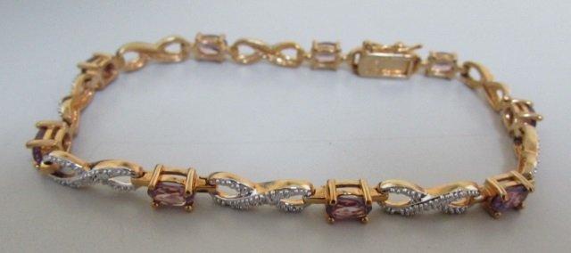 DIAMOND BRACELET 18K GOLD ON STERLING SILVER: 8" LONG, 6.2MM X 4.2MM SYN ALEXANDRITE STONES, WEIGHS 11 GRAMS. EXCELLENT NEVER USED CONDITION.