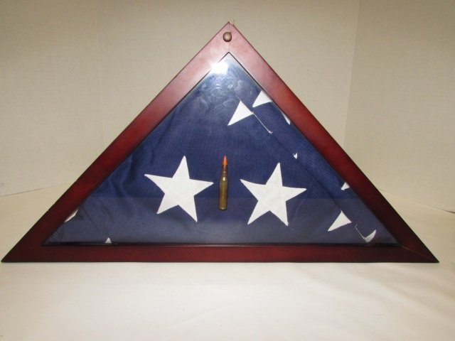 AMERICAN FLAG IN WOOD SHOWCASE 308 CARTRIDGE: VIETNAM ERA CLOTH FLAG IN WOOD SHOWCASE w/ 308 ROUND DISPLAY PIECE. (LIVE M1 GARAND CARTRIDGE).