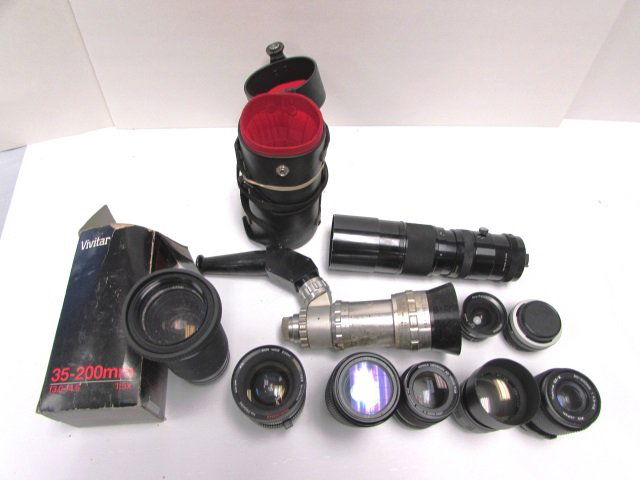 CAMERA LENSES LOT VIVITAR ZEISS BERTHIOT SOLIGOR: LOT OF 11 CAMERA LENSES. VARIOUS MAKES & MODELS. UNKNOWN MECHANICAL CONDITION.