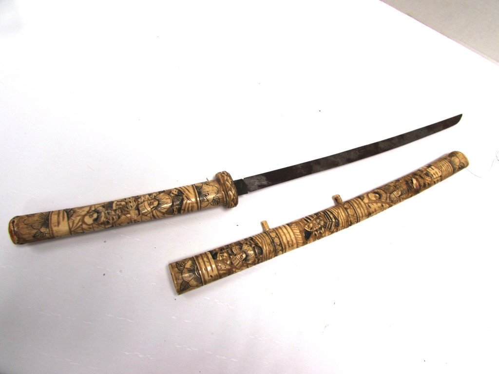 ANTIQUE ASIAN JAPANESE BONE SWORD & SCABBARD: SWORD OR WAKIZASHI w/ CARVED BONE HANDLE & SCABBARD. 17.5" BLADE, 27" OVERALL. SOME LOSSES.