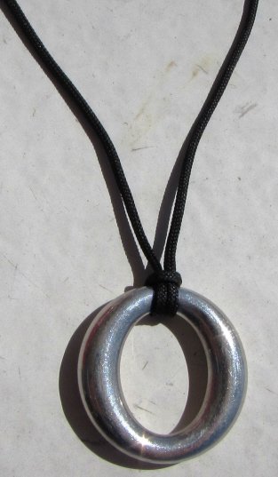 TIFFANY & CO STERLING SEVILLANA NECKLACE PERETTI: TIFFANY & CO. STERLING SILVER ELSA PERETTI SEVILLANA NECKLACE. PENDANT 1" TALL, 16" CORD NECKLACE. 9.8 GRAMS. (SHIPPING FOR THIS ITEM IS $3)