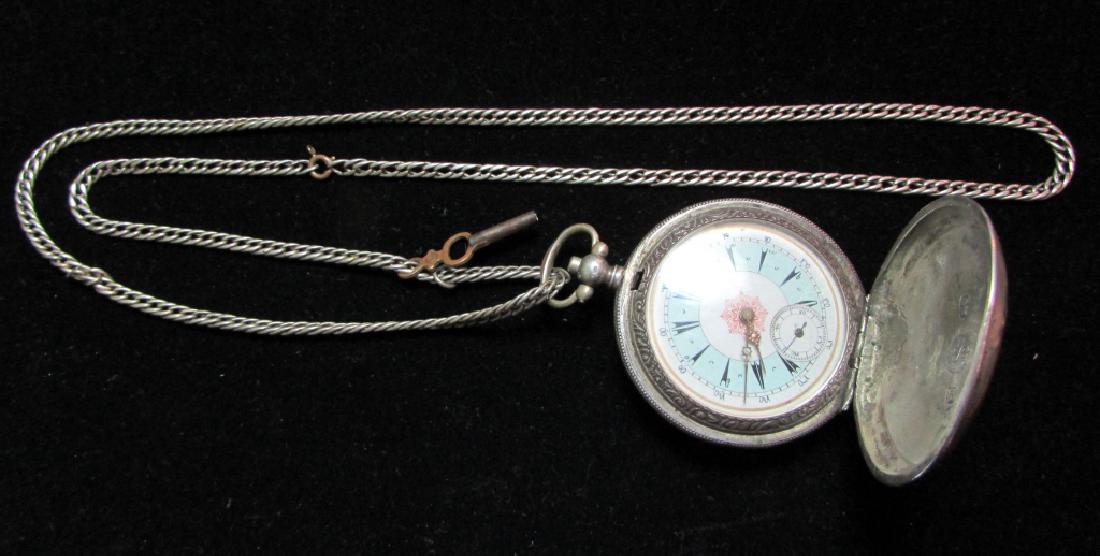 SILVER HUNTER POCKET WATCH J DENT LONDON AND CHAIN: 18 SIZE SILVER CASED HUNTER WITH CHAIN MARKED 800 J DENT LONDON. GOOD PAINTED PORCELAIN DIAL FANCY MOVEMENT. WITH SILVER CHAIN AND KEY. NON RUNNING