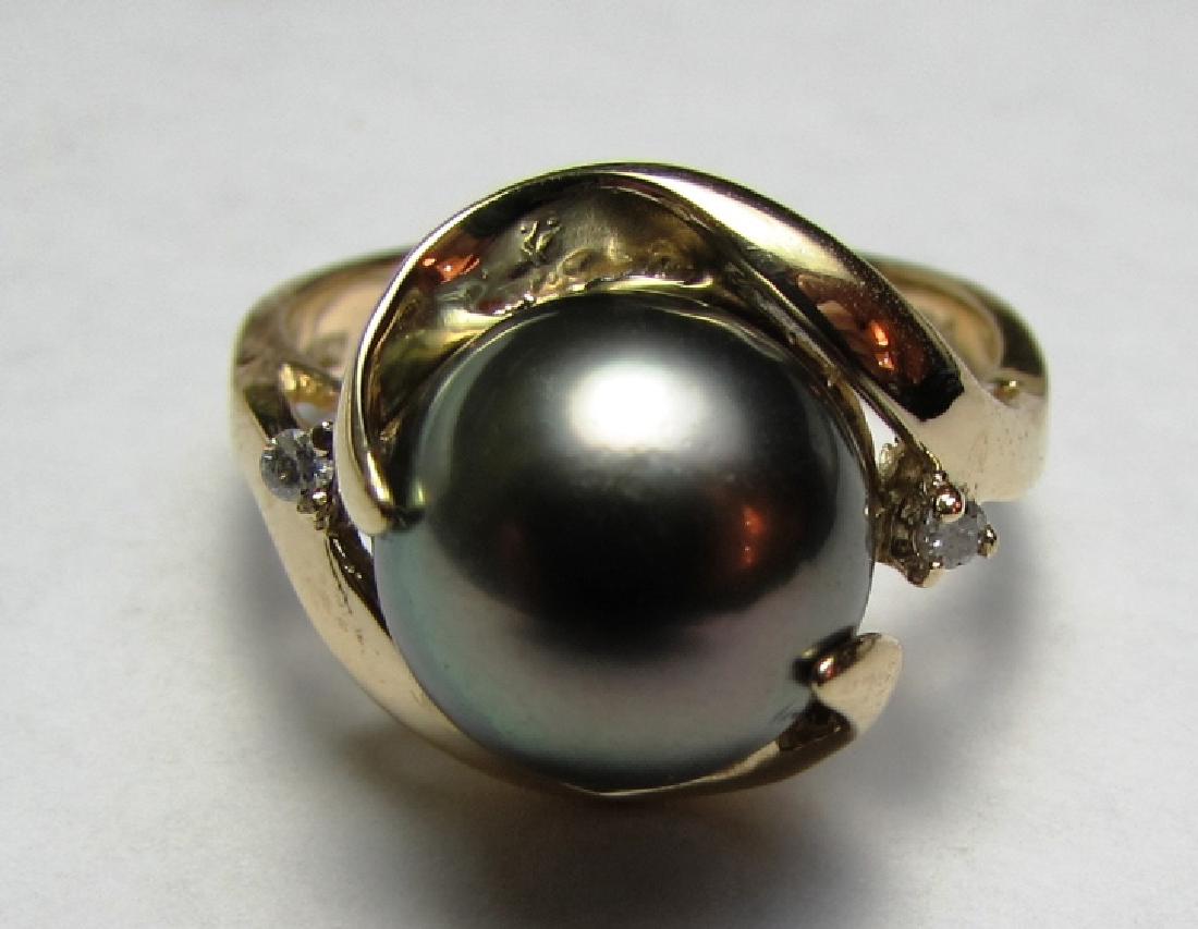 10MM TAHITIAN BLACK PEARL DIAMOND RING 14K GOLD: 14 k YELLOW GOLD RING w/ 10mm TAHITIAN BLACK PEARL & 2 2mm DIAMONDS. SIZE 6 3/4, 5.3 GRAMS. (USA SHIPPING FOR THIS ITEM IS $8).