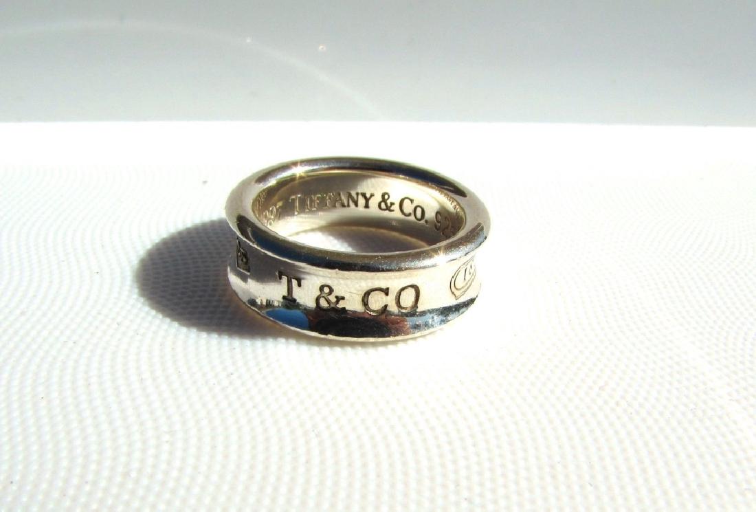 TIFFANY & CO STERLING SILVER RING CIGAR BAND 1837: GENUINE TIFFANY & CO. STERLING SILVER 1837 BAND RING. SIZE 6, 7.2 GRAMS. (US SHIPPING FOR THIS ITEM IS $5).