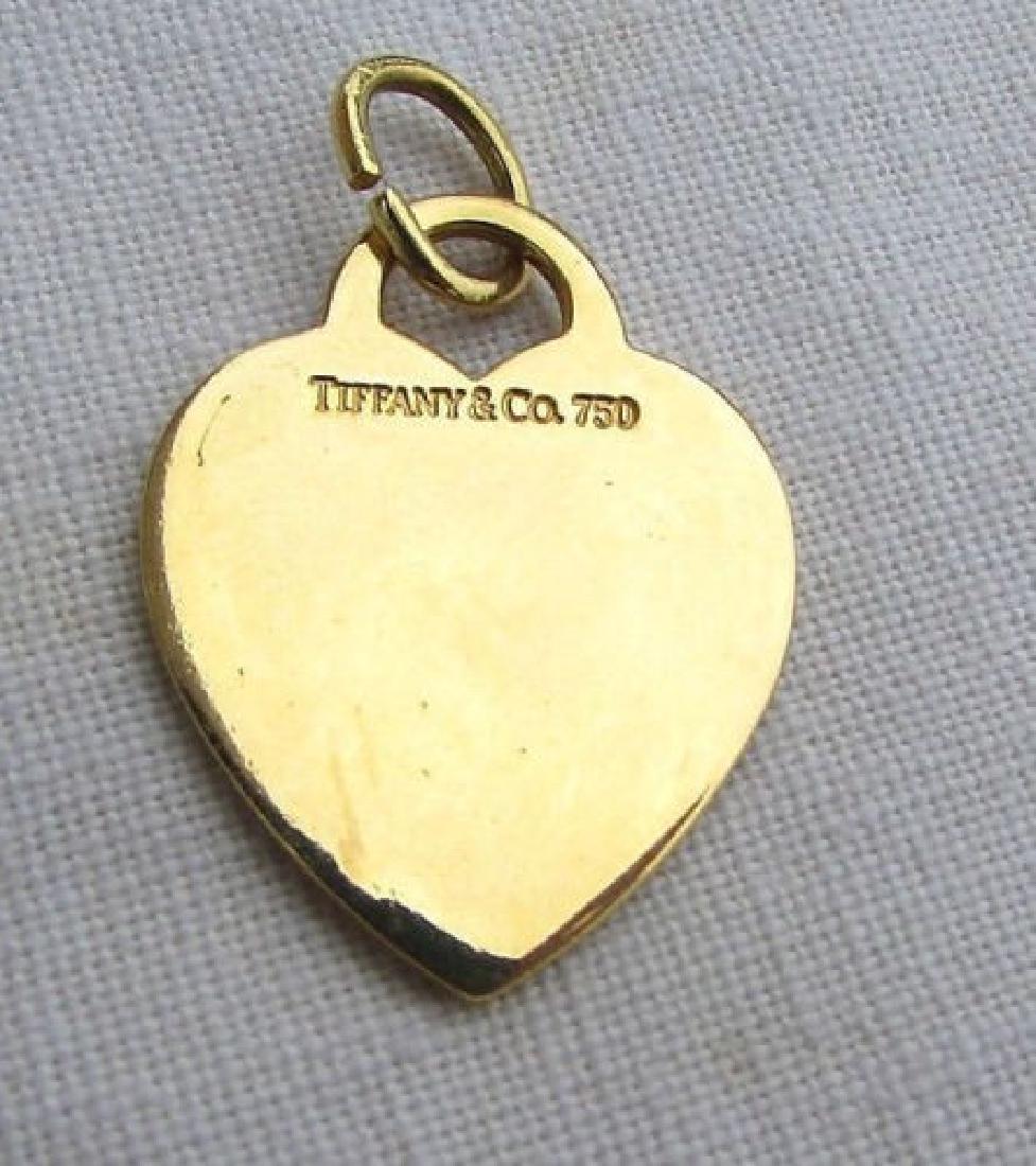 TIFFANY & CO 18k GOLD HEART CHARM PENDANT KEYCHAIN: GENUINE TIFFANY & CO. 18 k YELLOW GOLD HEART PENDANT. GREAT FOR NECKLACE, BRACELET, KEYCHAIN, ETC. 1.5" TALL w/ BALE. 6.8 GRAMS. (US SHIPPING FOR THIS ITEM IS $10).