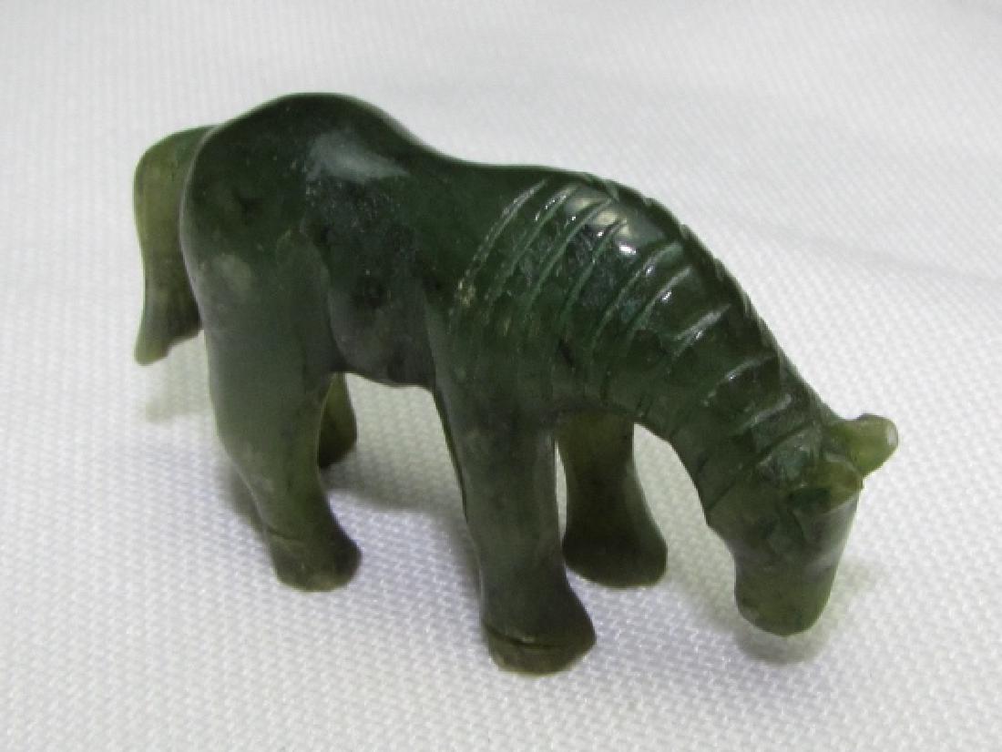CARVED JADE HORSE GREEN STATUE FIGURE STONE: GENUINE CARVED JADE HORSE FIGURINE. 7/8" TALL, 1.5" LONG, 7/16" WIDE. (US SHIPPING FOR THIS ITEM IS $3).