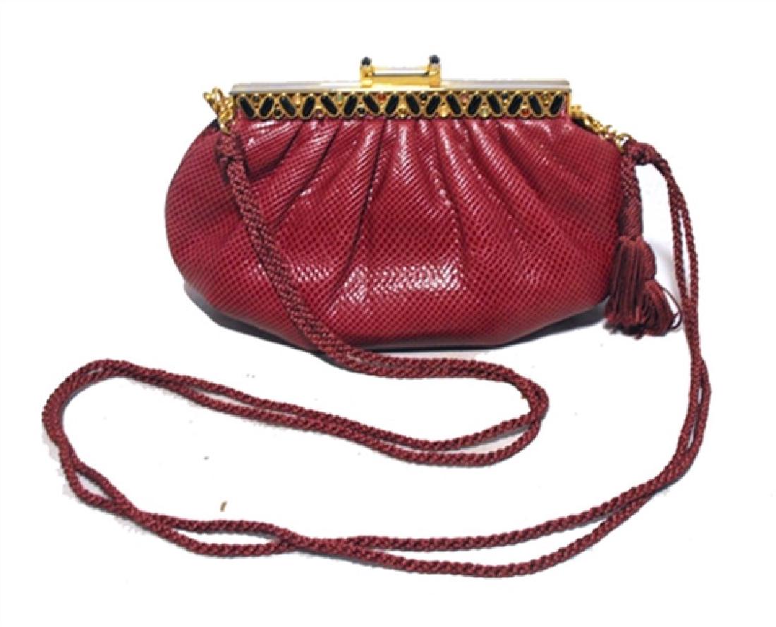 Judith Leiber Vintage Burgundy Lizard Leather Clutch: BEAUTIFUL JUDITH LEIBER vintage lizard clutch in excellent condition. Burgundy lizard leather exterior trimmed with gold hardware and a removable woven nylon shoulder strap. Pinch latch style closure