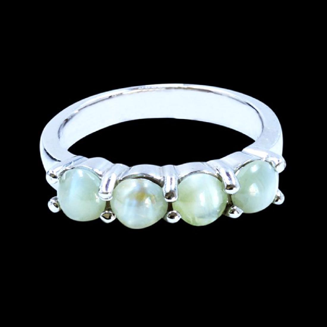 2.03CT NATURAL CATS EYE 14K WHITE GOLD RING: 14K WHITE GOLD NATURAL CATS EYE RING:4.47 GRAMS/CATS EYE:2.03CT//#GVR1070 **This remarable 2.03ct Oval Shape Cabochan Cat's Eye is known to clear the third eye and promote spiritual vision and knowled