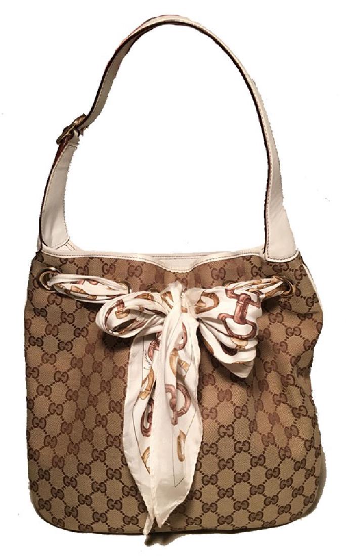 Gucci Monogram Canvas and Silk Scarf Shoulder Bag: Beautiful Gucci monogram canvas and silk scarf shoulder bag in very good condition. Monogram canvas exterior trimmed with white leather and white silk scarf woven through the top grommets and tied in