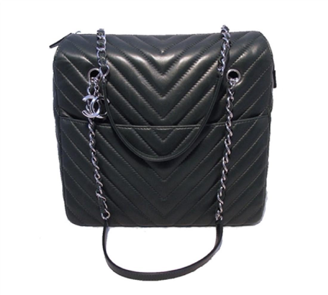 Authentic Chanel Quilted Green Lambskin Shoulder: AUTHENTIC Chanel quilted green lambskin shoulder shopping tote in excellent condition. Hunter green lambskin leather in a beautiful striped chevron pattern along both sides of the exterior with silver