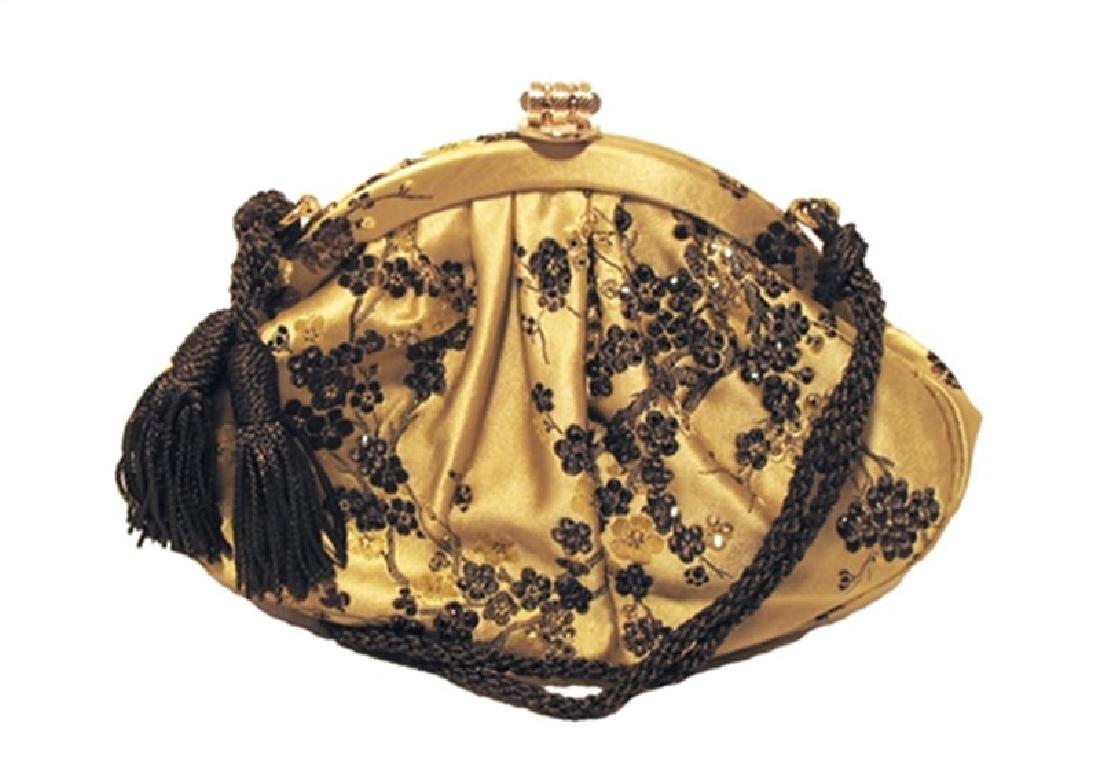 Judith Leiber Gold Silk & Swaovski Evening Bag: Judith Leiber silk & swarovski evening bag in excellent condition. Gold silk exterior with a beautiful embroidered floral pattern with swarovski crystal embellishments. Lift latch closure opens to a d