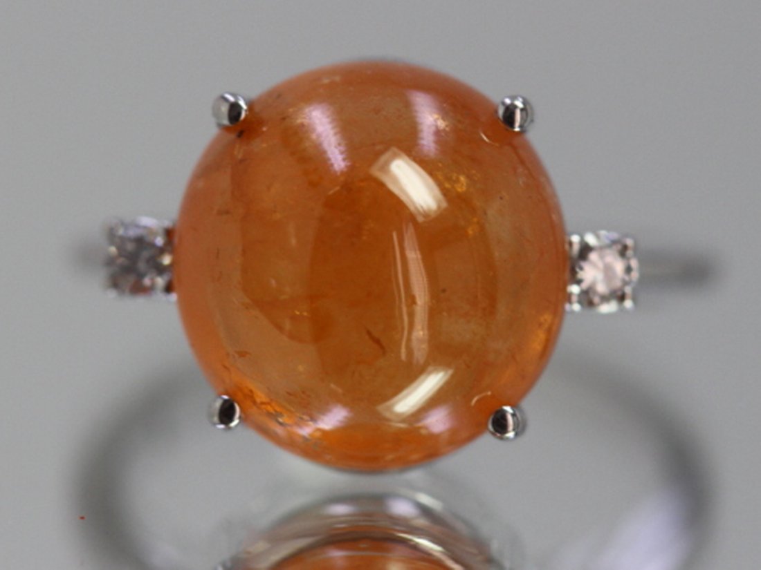 Natural Cabochon Mandarin Garnet w/ Diamond Ring: 14kt White Gold 2.68 Approx grams, 9.54ct Cabochon Mandarin Garnet Round Good Color, .09cttw Round Diamond, 4 prong Solitaire Style Ring, Appraisal Estimate $5000.00, Great Gift