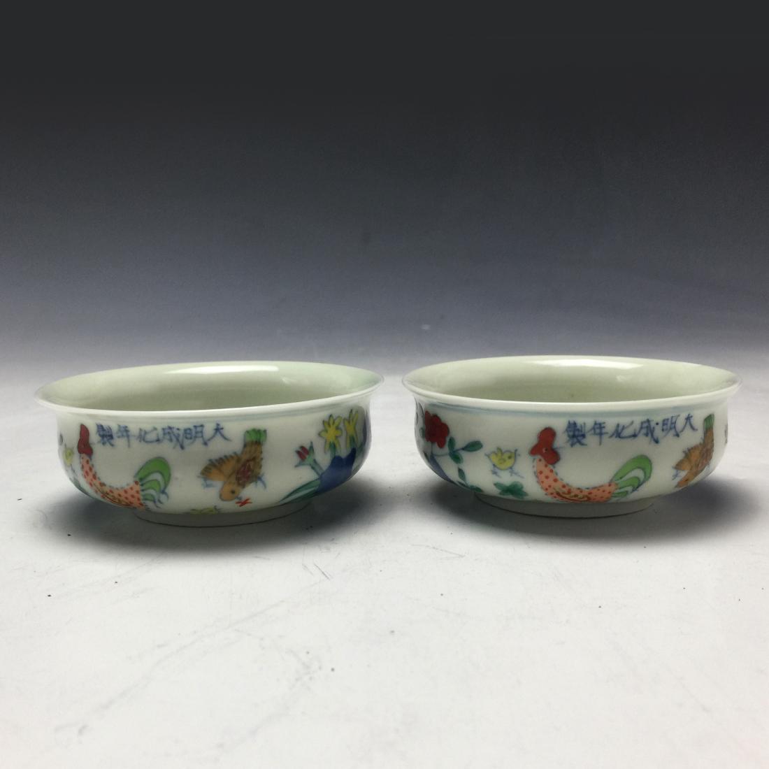 A Pair of Chinese Dou Cai Chicken Cylinder Cups: A Pair of Chinese Dou Cai Chicken Cylinder Cups; H: 1 1/4 in