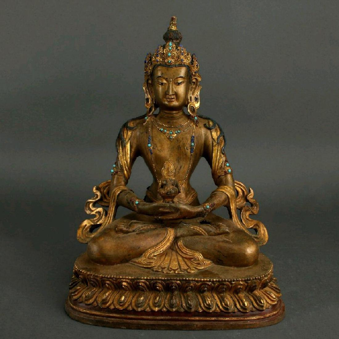 A RARE QING GEM INLAID GILDED BRONZE FIGURE OF BUDDHA (1 of 8)