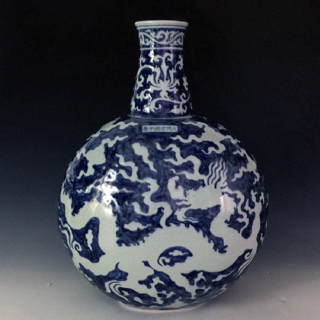 CHINESE BIUE AND WHITE MOON FLASKS: CHINESE BIUE AND WHITE MOON FLASKS, MING XUANG DE MARK, GOOD CONDITION; H: 18 IN D: 12 IN