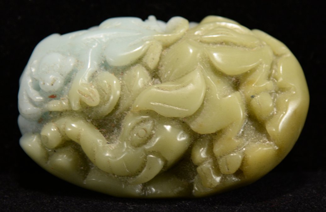 A JADE ORNAMENT OF ELEPHANT AND MONKEY: white jade ornament, a monkey riding on the elephant, 8cm in length
