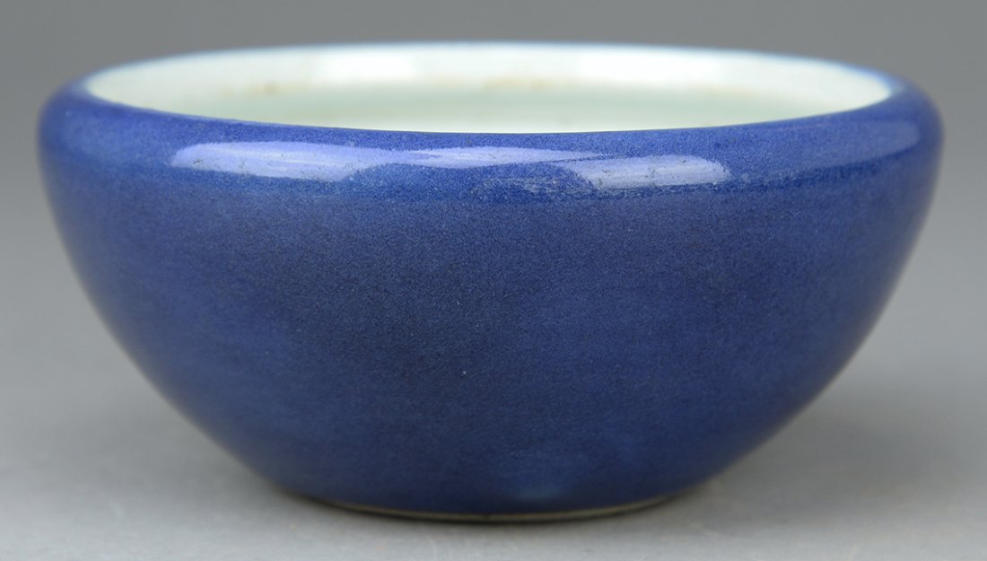 A blue glazed tripod washer: A blue glazed tripod washer