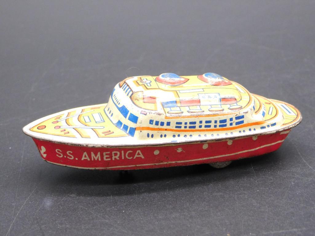 SS AMERICA METAL BOAT TOY: SS AMERICA METAL BOAT TOY *** Thank you for attending HATMAN AUCTIONS! Yes, we ship all items that are not oversized. Please see photos for measurements and description. SPECIAL NOTICE: Many items are