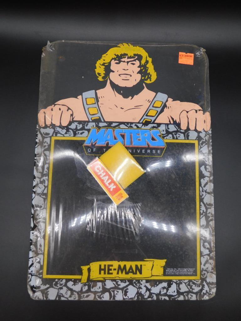 HE-MAN MASTERS OF THE UNIVERSE CHALK BOARD IN ORIGINAL: HE-MAN MASTERS OF THE UNIVERSE CHALK BOARD IN ORIGINAL PACKAGING *** Thank you for attending HATMAN AUCTIONS! Yes, we ship all items that are not oversized. Please see photos for measurements and desc