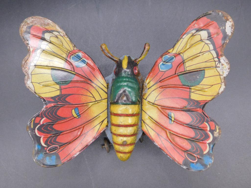 GERMAN BUTTERFLY WIND UP FRICTION TIN TOY VINTAGE TOY: Thank you for attending HATMAN AUCTIONS! Yes, we ship all items that are not oversized. Please see photos for measurements and description. SPECIAL NOTICE: Many items are PICK UP ONLY by APPOINTMENT O
