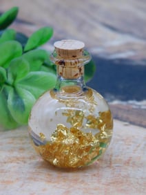 GOLD FLAKES IN BOTTLE ROCK STONE LAPIDARY SPECIMEN