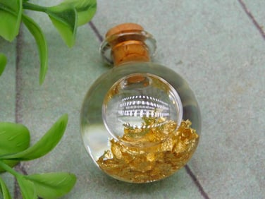 GOLD FLAKES IN BOTTLE ROCK STONE LAPIDARY SPECIMEN