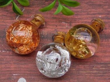 GOLD SILVER AND COPPER FLAKES IN BOTTLES