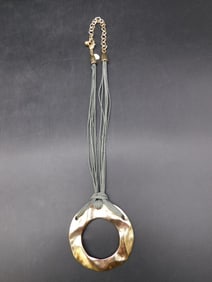 METAL PENDANT ON MULTI-STRAND NECKLACE