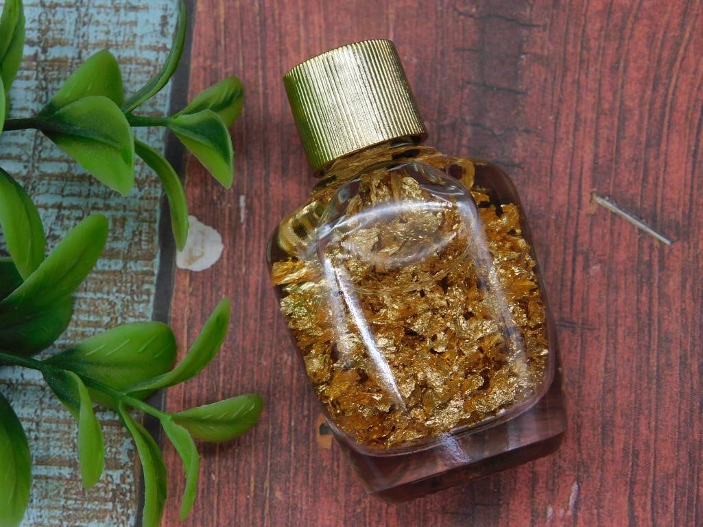 Small Glass Bottle with Gold-Colored Flakes (1 of 2)