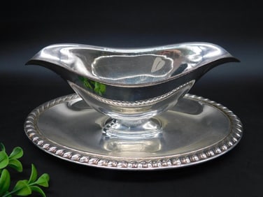 Silver gravy boat with tray