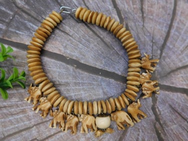 Carved Bone Necklace With Elephant Charms