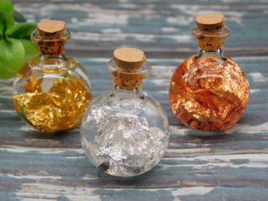 GOLD SILVER AND COPPER FLAKES IN BOTTLES