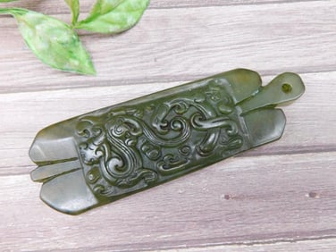 Carved Green Jade Pendant With Ornamental Design