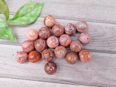 Collection of Pinkish Beads With Drill Holes