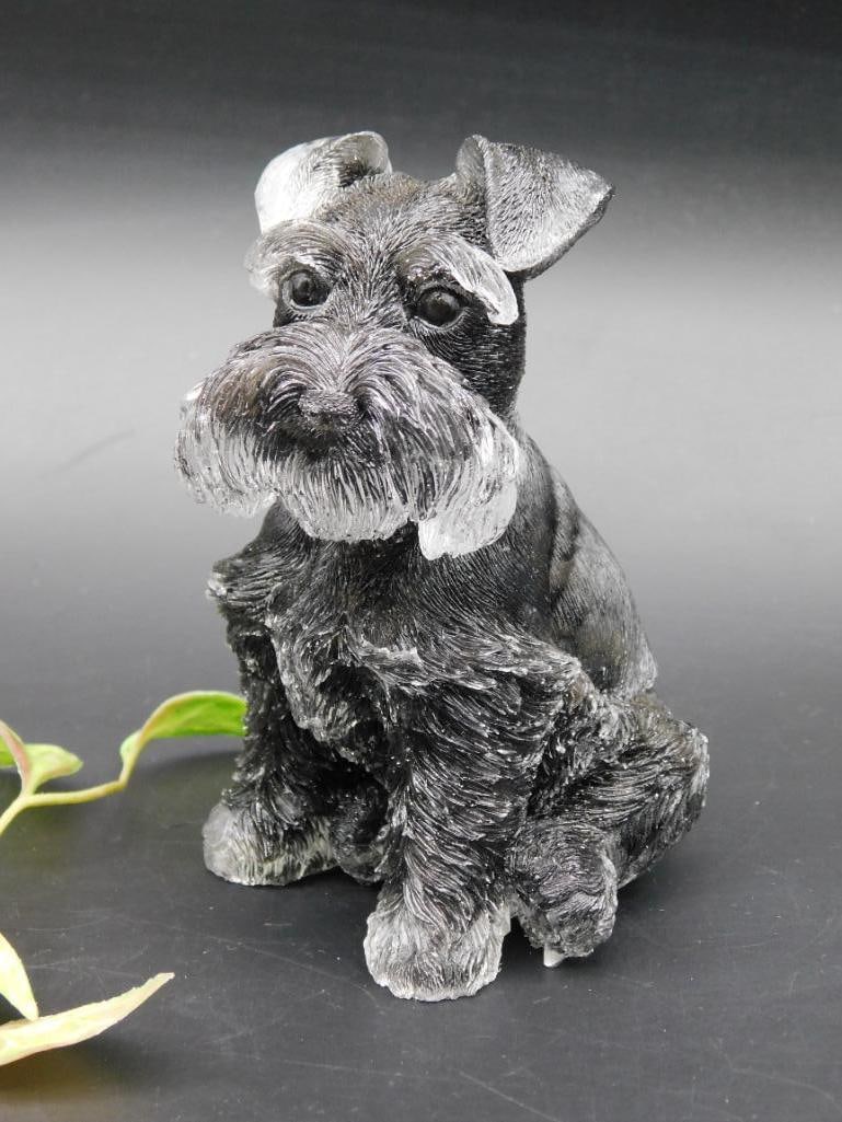 Decorative Schnauzer Dog Figurine: A detailed figurine of a Schnauzer dog, crafted with attention to texture and fur detail. Features a sitting pose and comes in a dark color finish. Item dimensions are shown next to a ruler for scale.