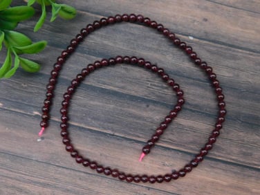 Strand of Polished Garnet Beads on String
