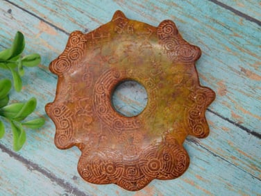 Carved Decorative Jade Disc with Intricate Patterns