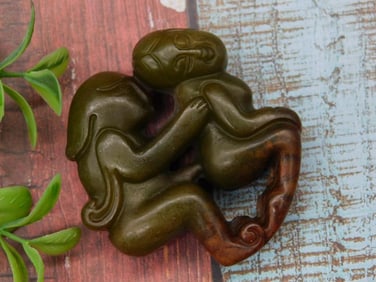 Carved Green and Brown Jade Figurine