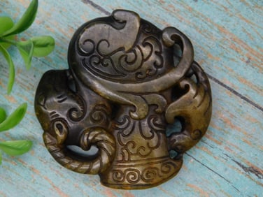 Carved Jade Pendant with Floral Motif Design