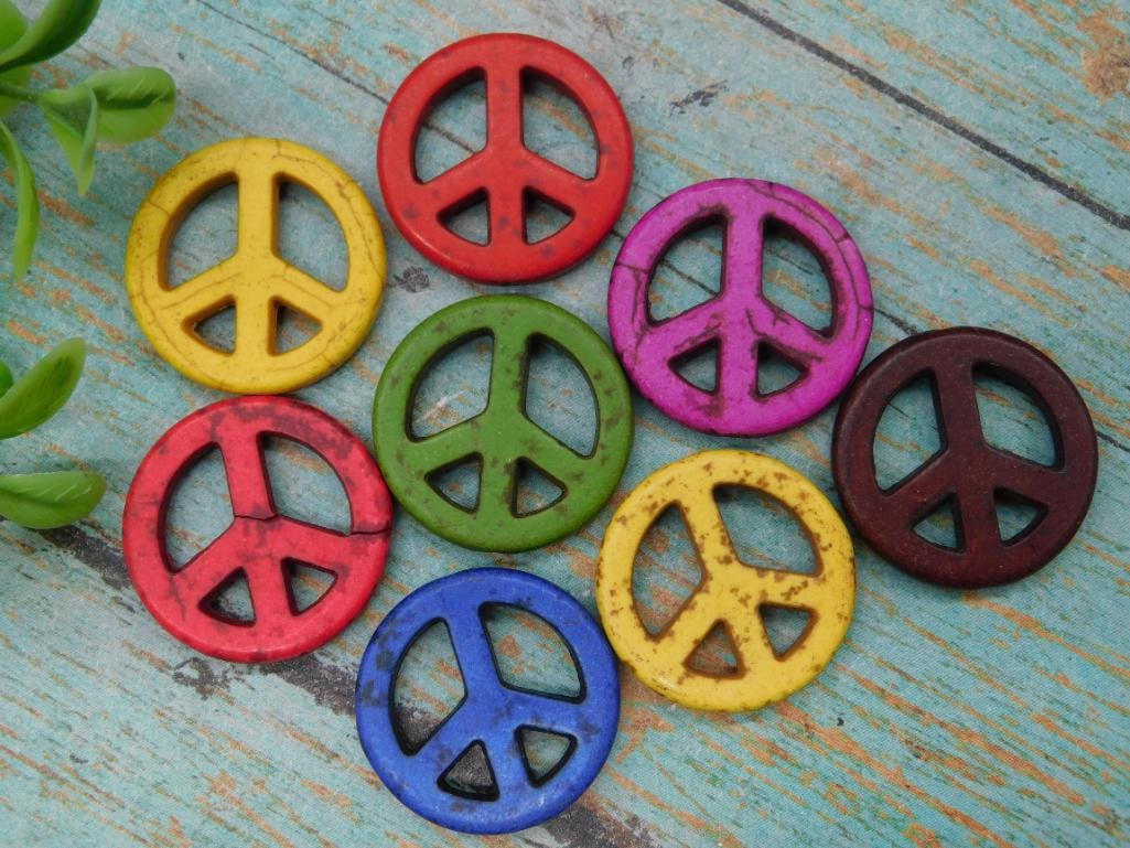 Set of Nine Colorful Peace Sign Charms: This lot includes a set of nine colorful peace sign charms in various colors, including red, yellow, green, purple, blue, and brown. Each charm features a classic peace sign design with cutout details