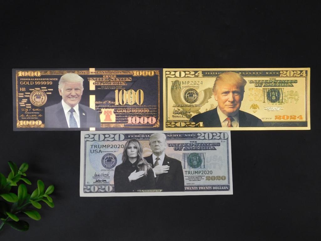Set of Three USA Themed Novelty Banknotes: Set includes three novelty banknotes featuring USA-related designs. Banknotes display portraits and details styled with gold-tone and printed elements. Each bill showcases imagery of the White House o