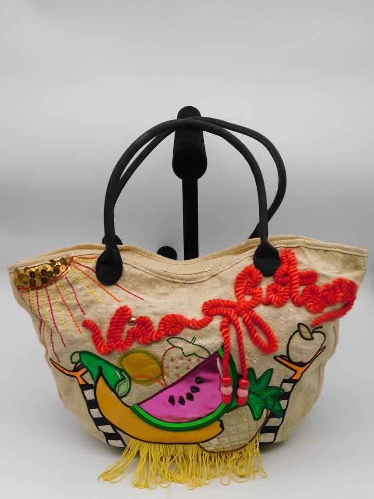 Betsey Johnson Canvas Tote Bag with Fruit Embroidery: Canvas tote bag designed by Betsey Johnson featuring vibrant fruit-themed embroidery including watermelon, banana, pineapple, and more. The bag includes red rope accents and beading details. Interior 