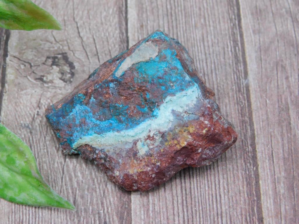 Chrysocolla Specimen Weighing 31 Grams: This lot features a vibrant natural mineral specimen with a mix of earthy tones and striking blue hues. Weighing approximately 31 grams, this piece is ideal for collectors or as a display. The ruler s