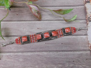 Beaded Bracelet With Red Stone Accents and Silver Details