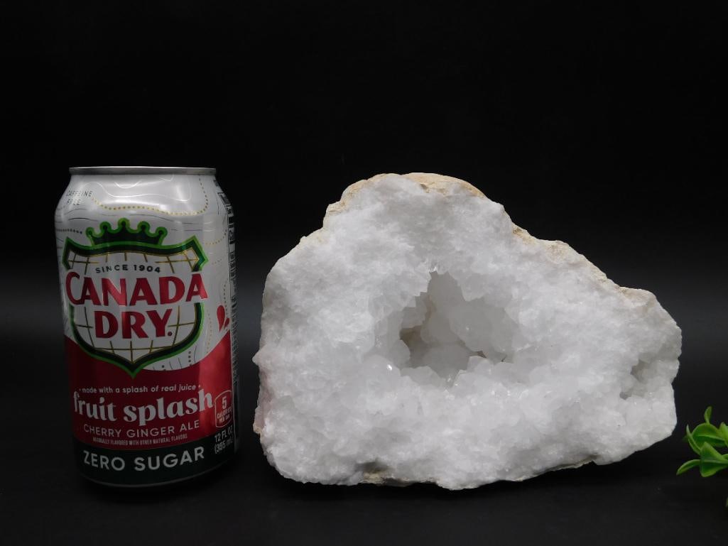 White Quartz Druzy Geode Specimen With Cavity: A striking white quartz druzy geode featuring a natural cavity at its center. The piece displays a crystal-laden interior surrounded by a rough, natural exterior. The geode is ideal for display or col